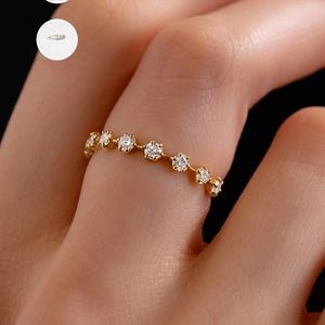 Gold “Diamond Distance Band” Ring from Melanie Casey